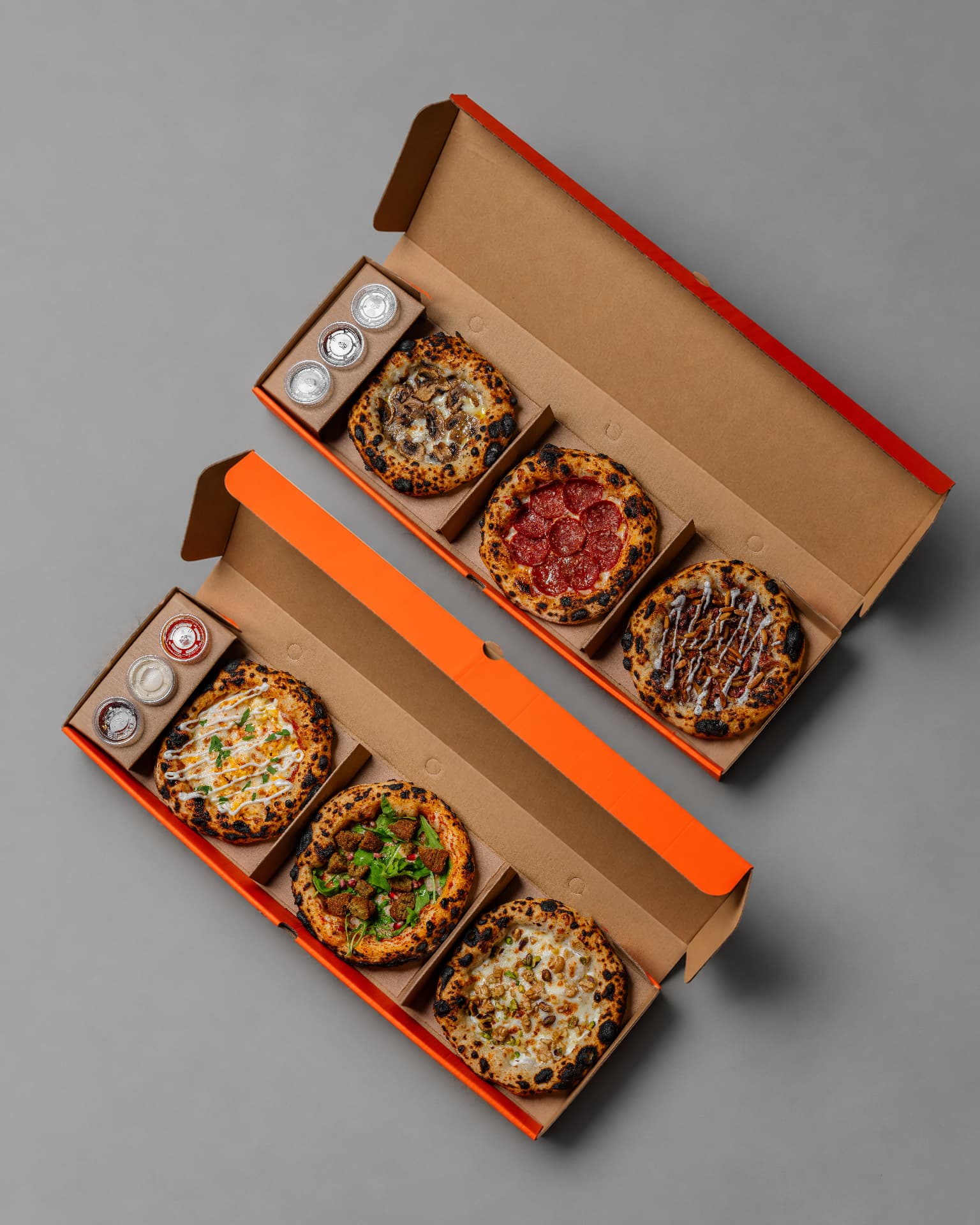 Two boxes, six mini pizzas